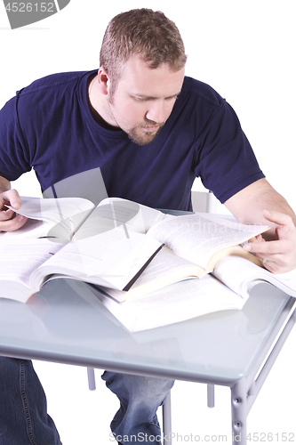 Image of College Student with Books on the Table Studying