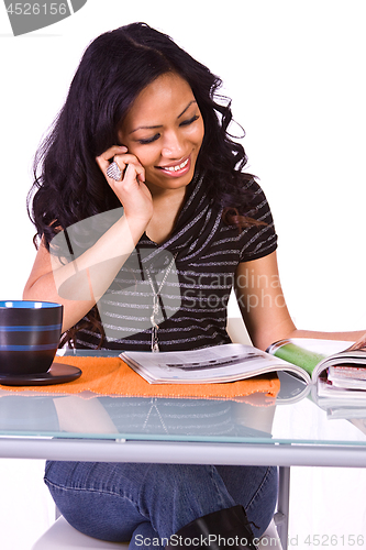 Image of Beautiful Woman Reading a Magazine