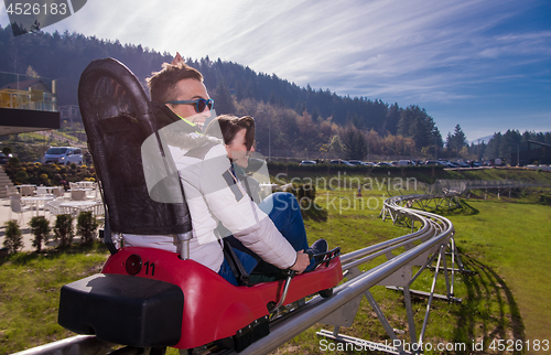 Image of couple driving on alpine coaster