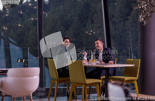 Image of loving couple enjoying romantic dinner