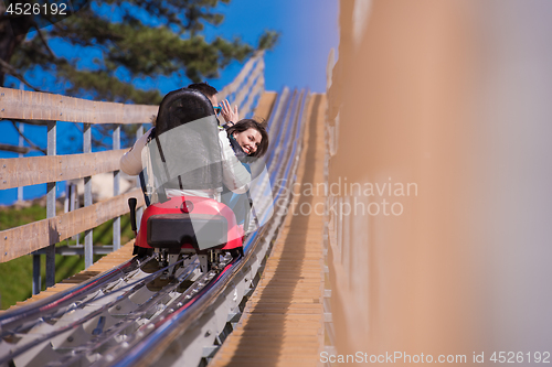 Image of couple driving on alpine coaster