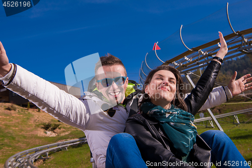 Image of couple driving on alpine coaster