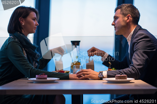 Image of loving couple enjoying romantic dinner