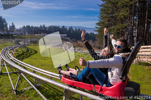 Image of couple driving on alpine coaster