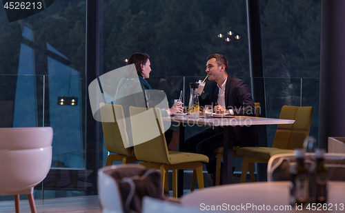 Image of loving couple enjoying romantic dinner