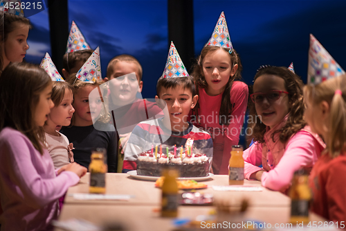 Image of young boy having birthday party