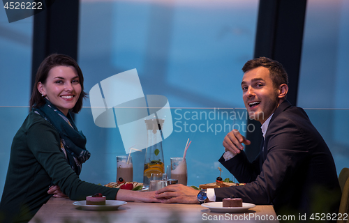 Image of loving couple enjoying romantic dinner