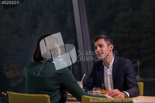 Image of loving couple enjoying romantic dinner