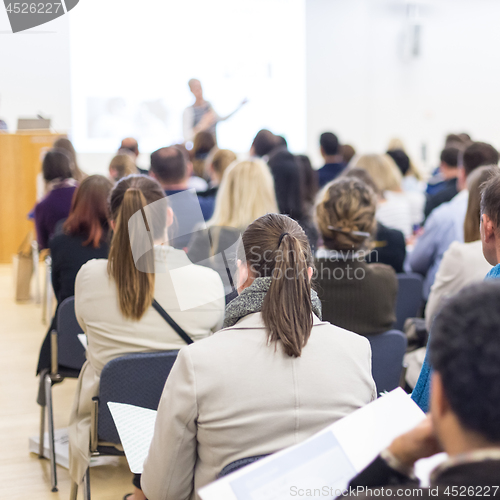 Image of Woman giving presentation on business conference.