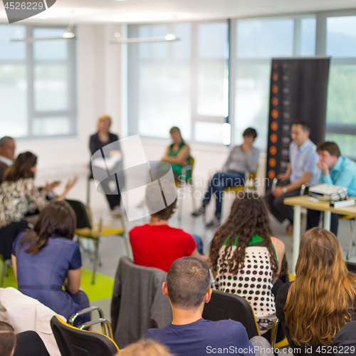 Image of Round table discussion at business and entrepreneurship convention.