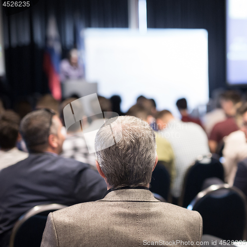 Image of Business speaker giving a talk at business conference event.