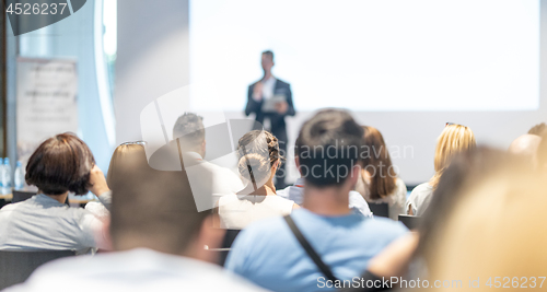 Image of Male business speaker giving a talk at business conference event.