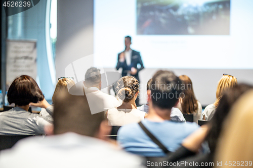 Image of Male business speaker giving a talk at business conference event.