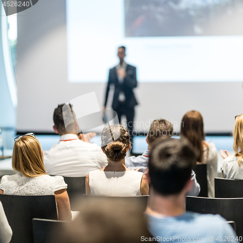 Image of Male business speaker giving a talk at business conference event.