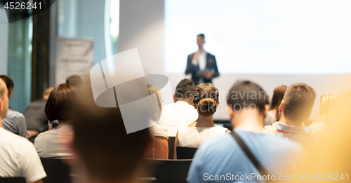 Image of Male business speaker giving a talk at business conference event.