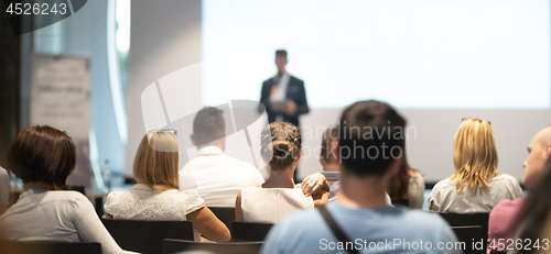 Image of Male business speaker giving a talk at business conference event.