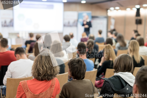 Image of Business speaker giving a talk at business conference event.