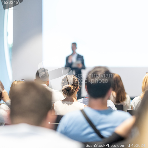 Image of Male business speaker giving a talk at business conference event.