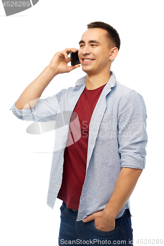 Image of happy young man calling on smartphone