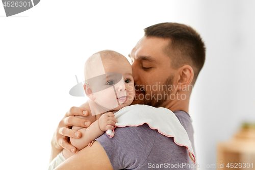 Image of father with little baby girl at home