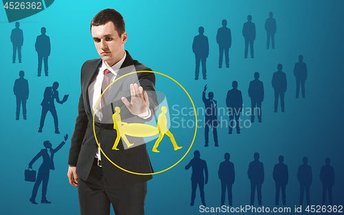 Image of Businessman touching virtual screen on blue background