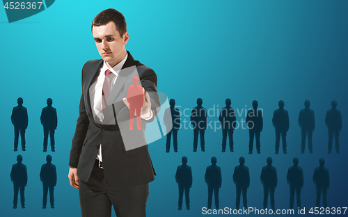 Image of Businessman touching virtual screen on blue background