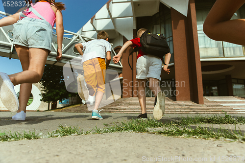 Image of Happy kids playing at city\'s street in sunny summer\'s day