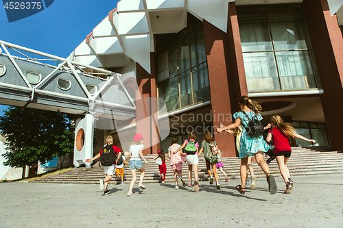 Image of Happy kids playing at city\'s street in sunny summer\'s day