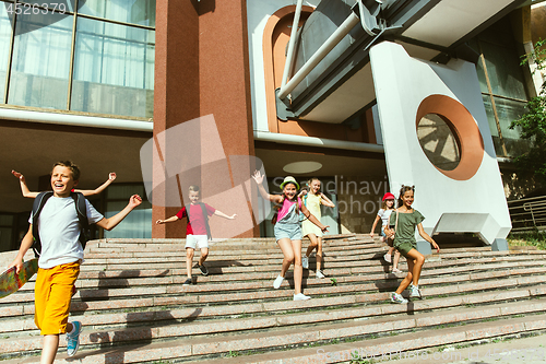 Image of Happy kids playing at city\'s street in sunny summer\'s day