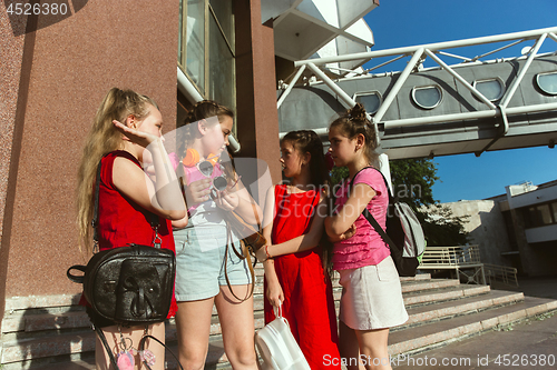Image of Happy kids playing at city\'s street in sunny summer\'s day