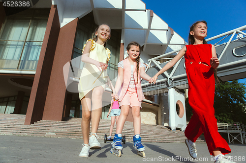 Image of Happy kids playing at city\'s street in sunny summer\'s day