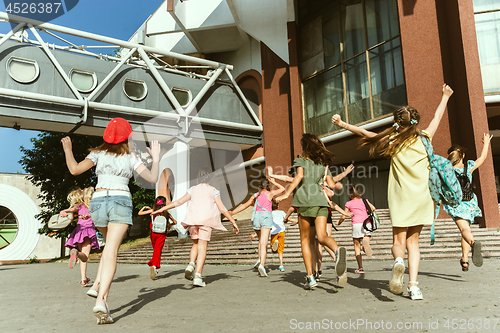 Image of Happy kids playing at city\'s street in sunny summer\'s day
