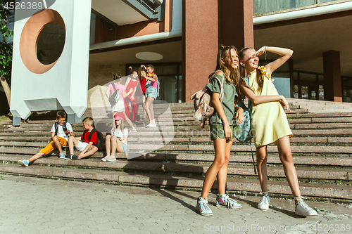 Image of Happy kids playing at city\'s street in sunny summer\'s day