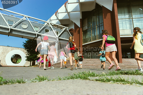 Image of Happy kids playing at city\'s street in sunny summer\'s day