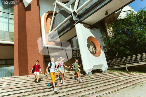 Image of Happy kids playing at city\'s street in sunny summer\'s day