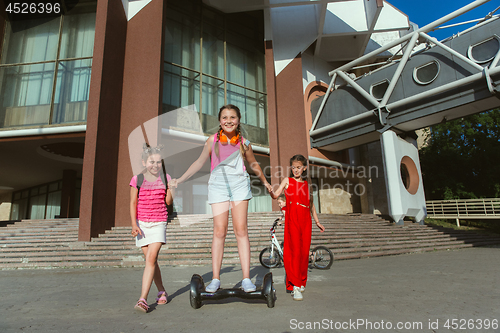 Image of Happy kids playing at city\'s street in sunny summer\'s day