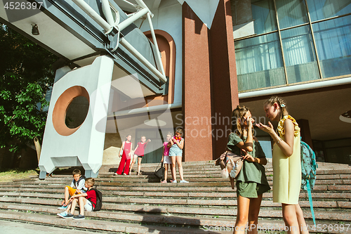 Image of Happy kids playing at city\'s street in sunny summer\'s day