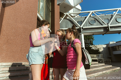 Image of Happy kids playing at city\'s street in sunny summer\'s day