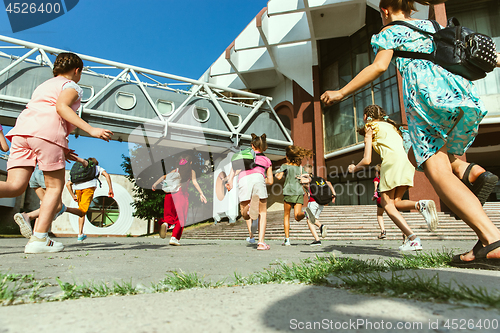 Image of Happy kids playing at city\'s street in sunny summer\'s day