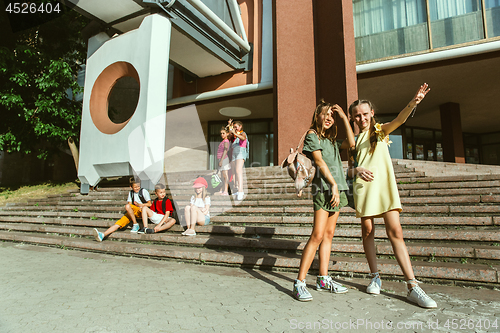 Image of Happy kids playing at city\'s street in sunny summer\'s day