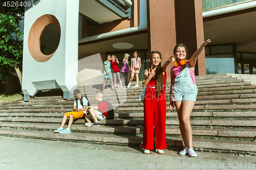 Image of Happy kids playing at city\'s street in sunny summer\'s day