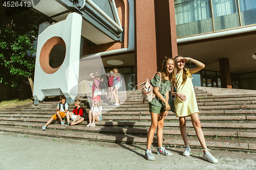 Image of Happy kids playing at city\'s street in sunny summer\'s day