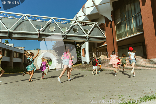 Image of Happy kids playing at city\'s street in sunny summer\'s day