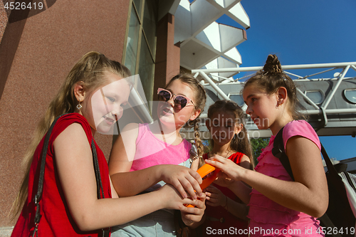 Image of Happy kids playing at city\'s street in sunny summer\'s day