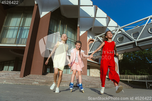 Image of Happy kids playing at city\'s street in sunny summer\'s day