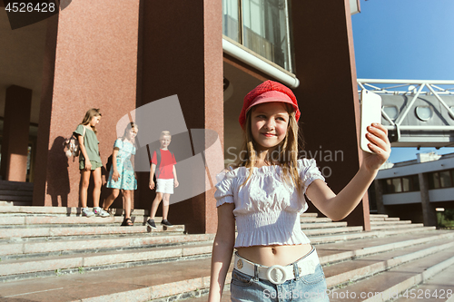 Image of Happy kids playing at city\'s street in sunny summer\'s day