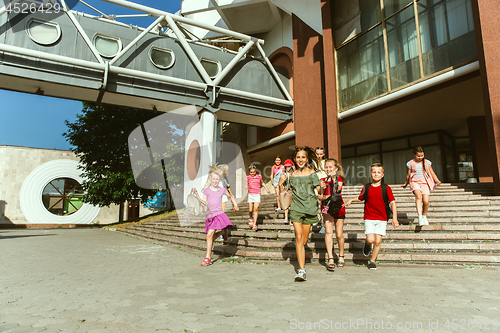 Image of Happy kids playing at city\'s street in sunny summer\'s day