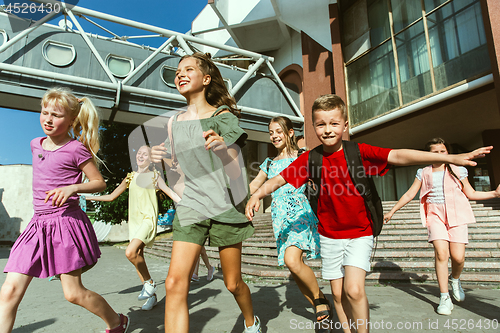 Image of Happy kids playing at city\'s street in sunny summer\'s day