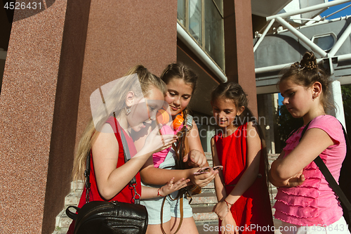 Image of Happy kids playing at city\'s street in sunny summer\'s day