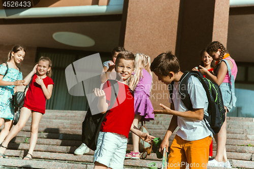 Image of Happy kids playing at city\'s street in sunny summer\'s day